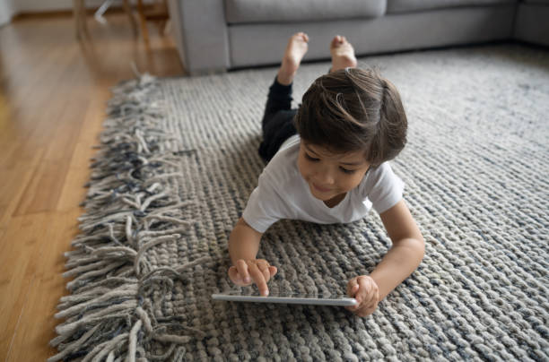 Girl lying on carpet | TUF Flooring LLC