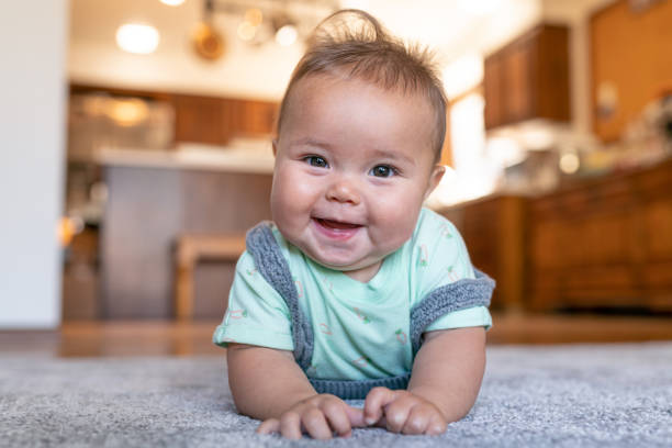 Baby lying on carpet flooring | TUF Flooring LLC